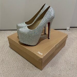 Bedazzled red bottom platform heels